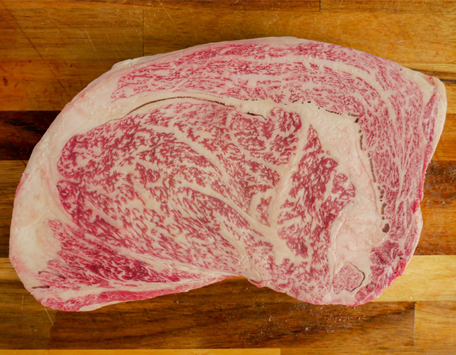 Wagyu A5 for Ozaki with its BMS 11+ details sitting on a wooden background